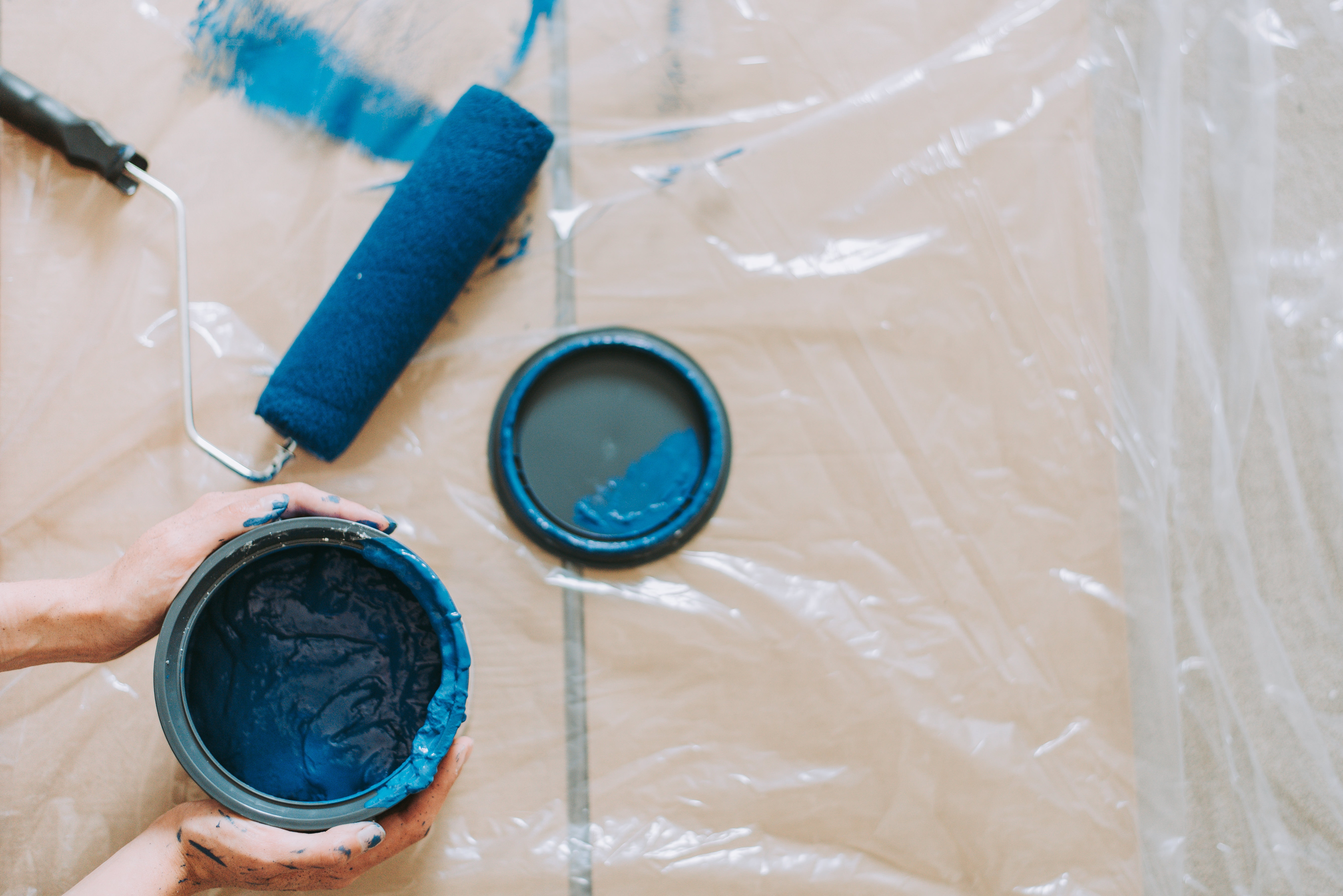 Blue Paint Beside Blue Paint Roller
